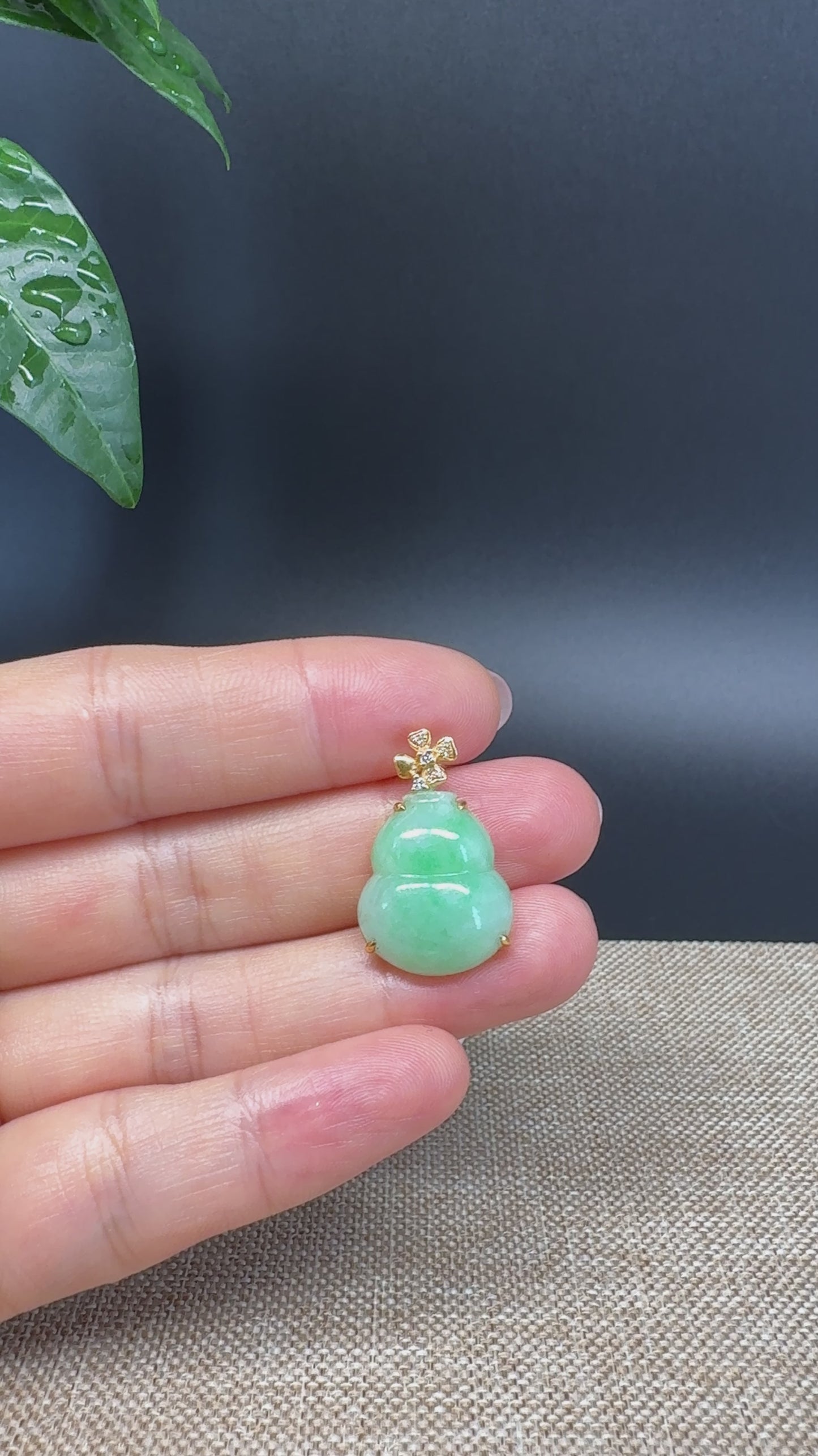 Load and play video in Gallery viewer, RealJade® Co. Genuine Green Jadeite Jade Good Luck Hulu Bottle Gourd Necklace With 18K Yellow Gold Bail
