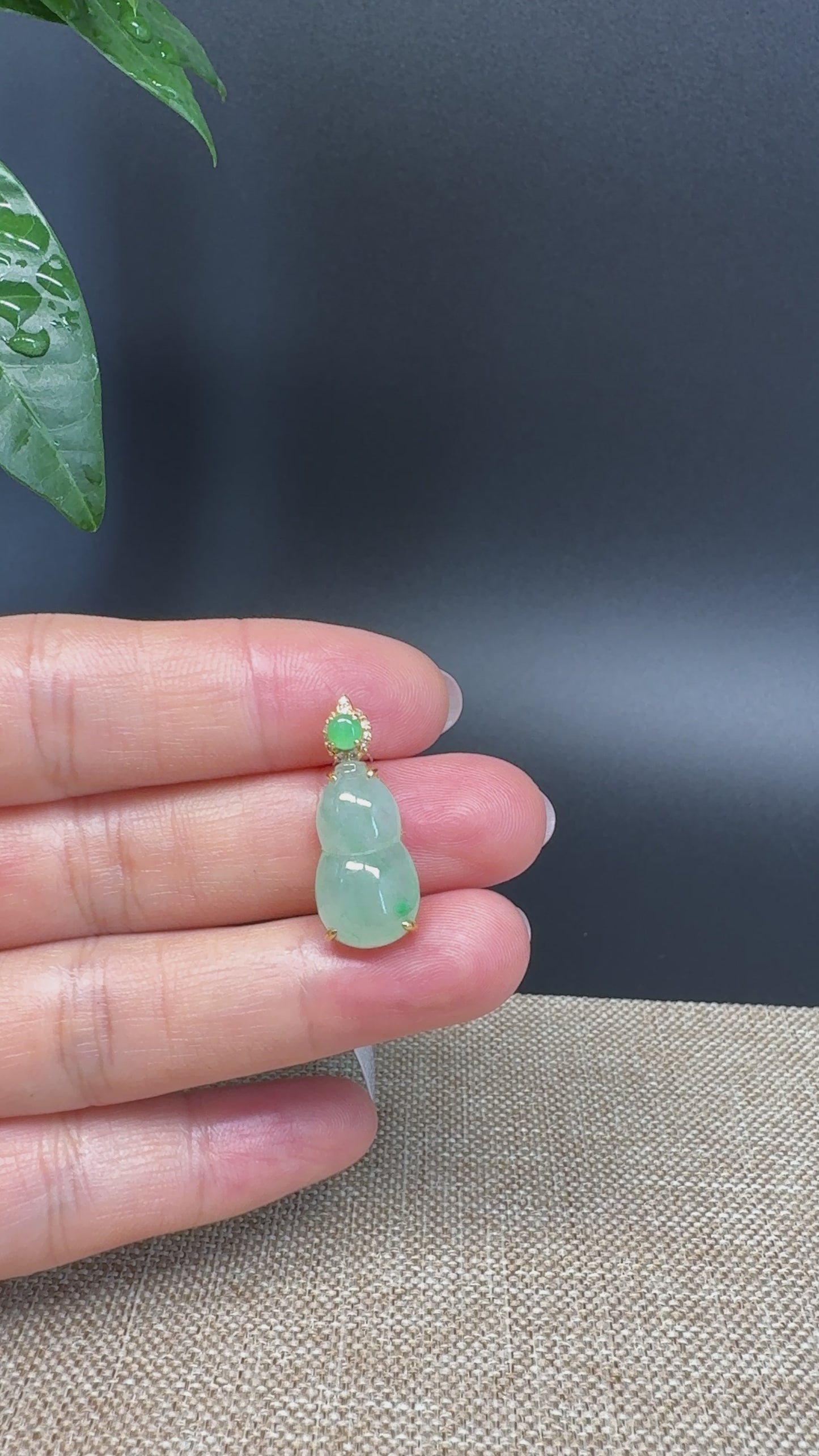 Load and play video in Gallery viewer, RealJade® Co. Genuine Ice Green Jadeite Jade Good Luck Hulu Bottle Gourd Necklace With 18K Yellow Gold Bail
